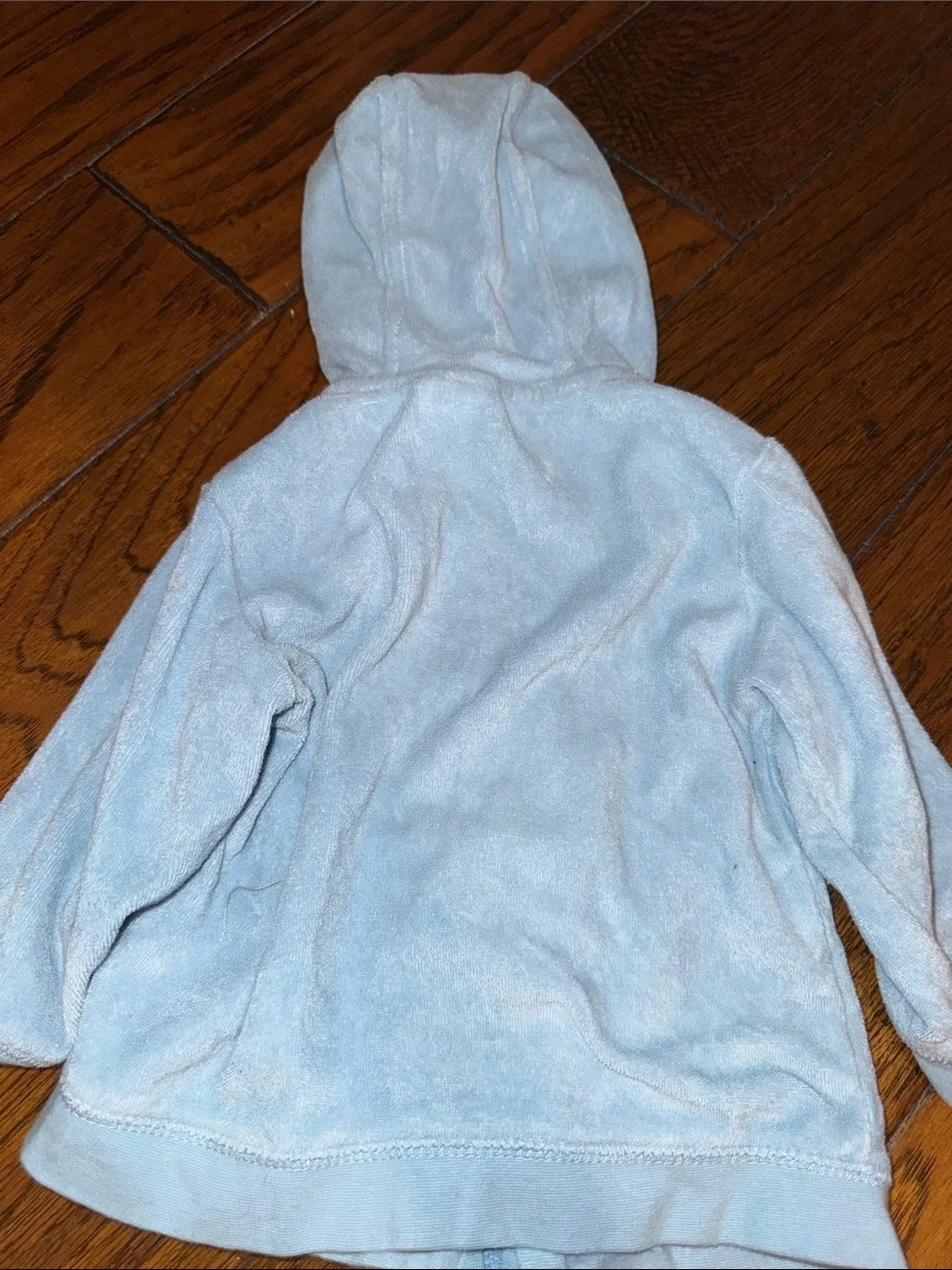 Baby Short-Sleeve One-Piece Bodysuit and a blue zipper sweater